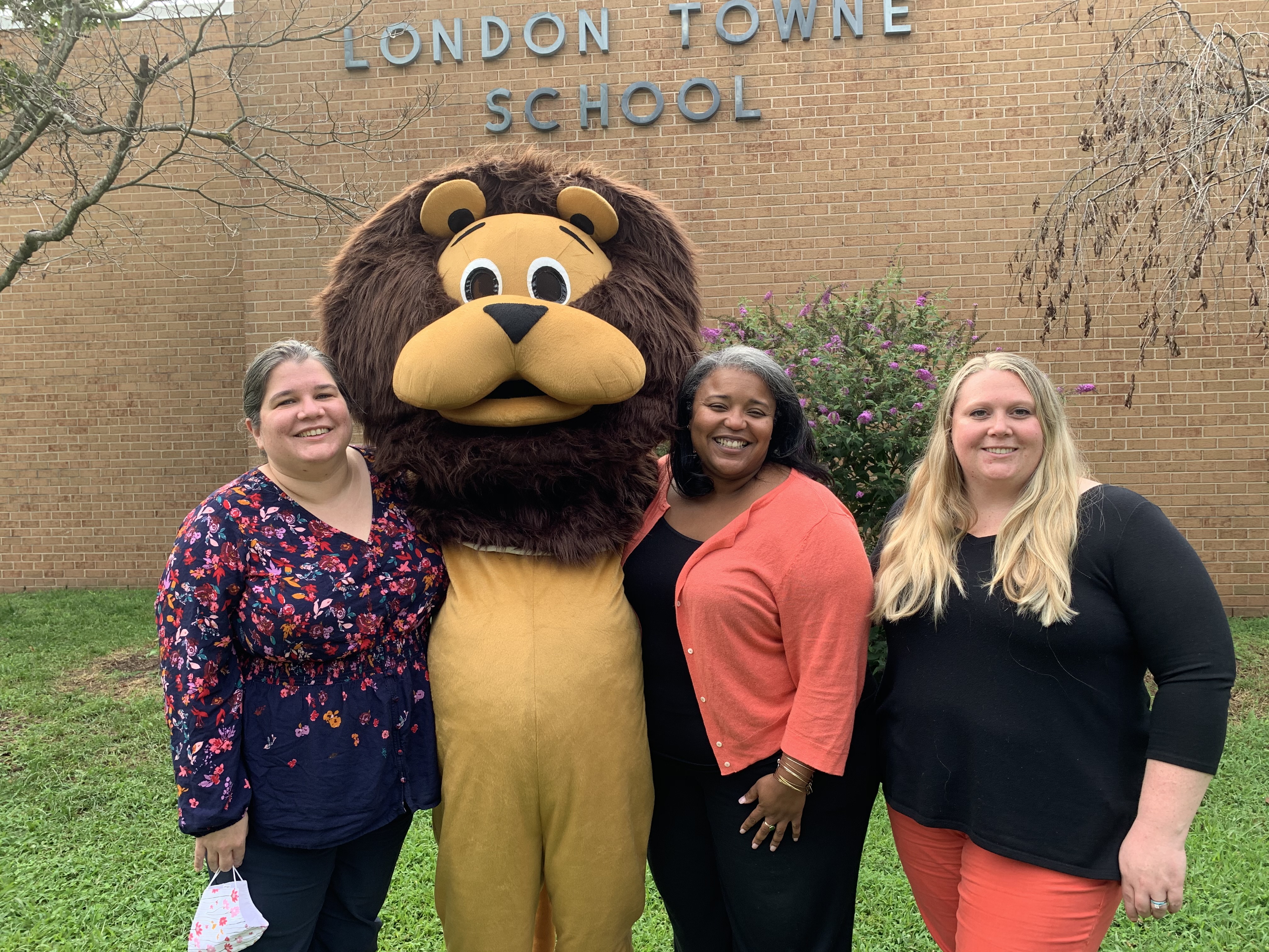 photo of admin team with Leo the Lion